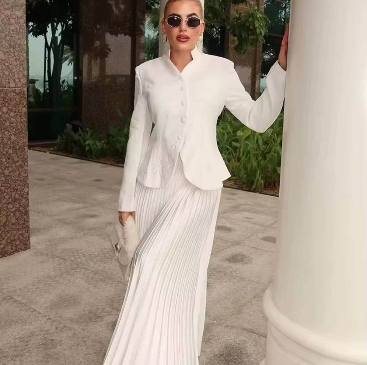 tailored blazer with flowing pleated maxi skirt