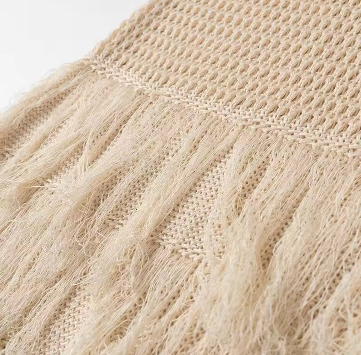 Beige knit mini dress with layered fringe hem