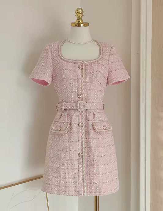 tweed mini dress with pearl buttons and a belted waist