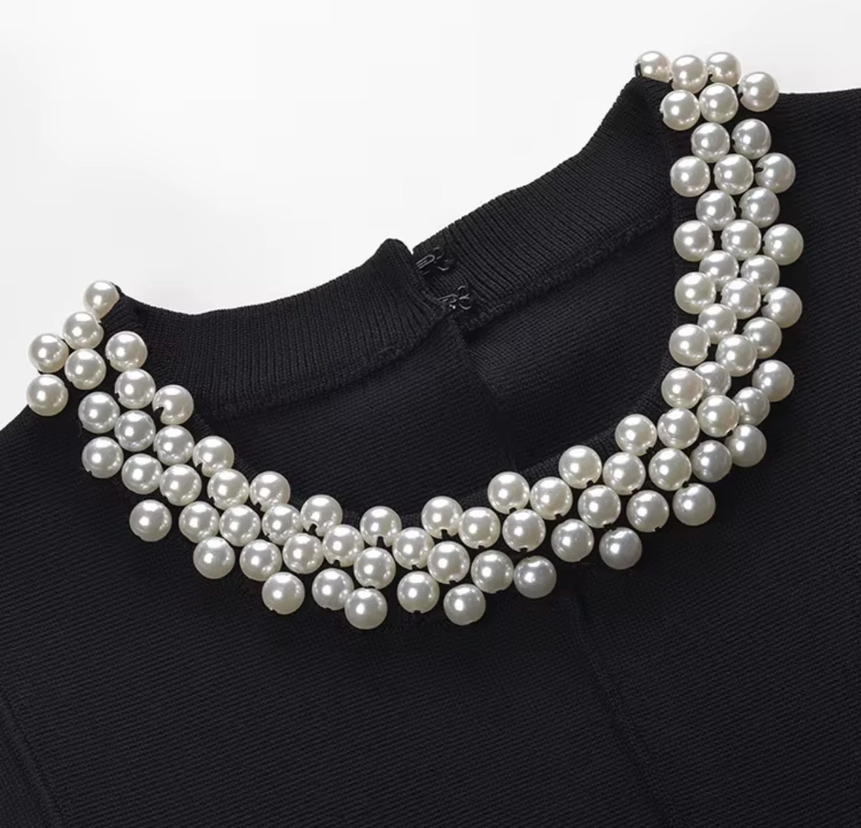 Sleeveless Black Mini Dress with White Ruffle Hem