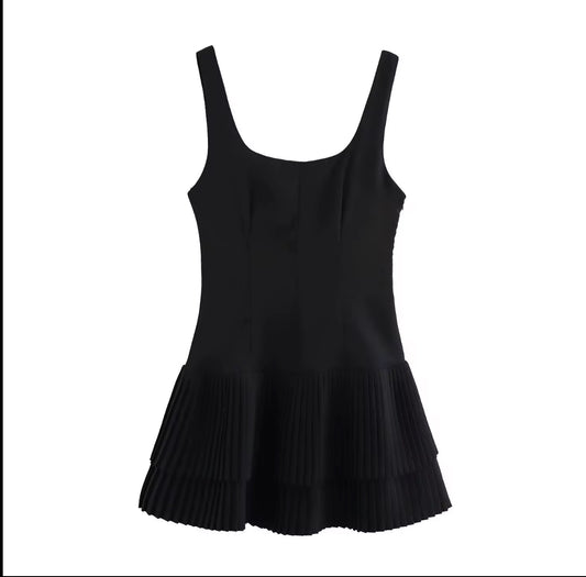 fitted bodice with a playful pleated layered hem dress