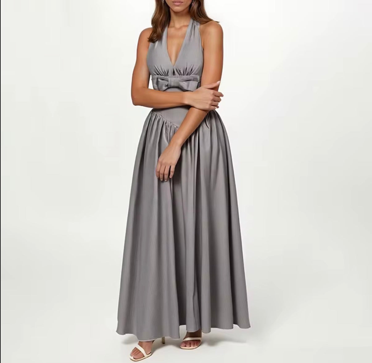 Elegant Halter Neck Maxi Dress with Sculpted Waist and Statement Bow Detail