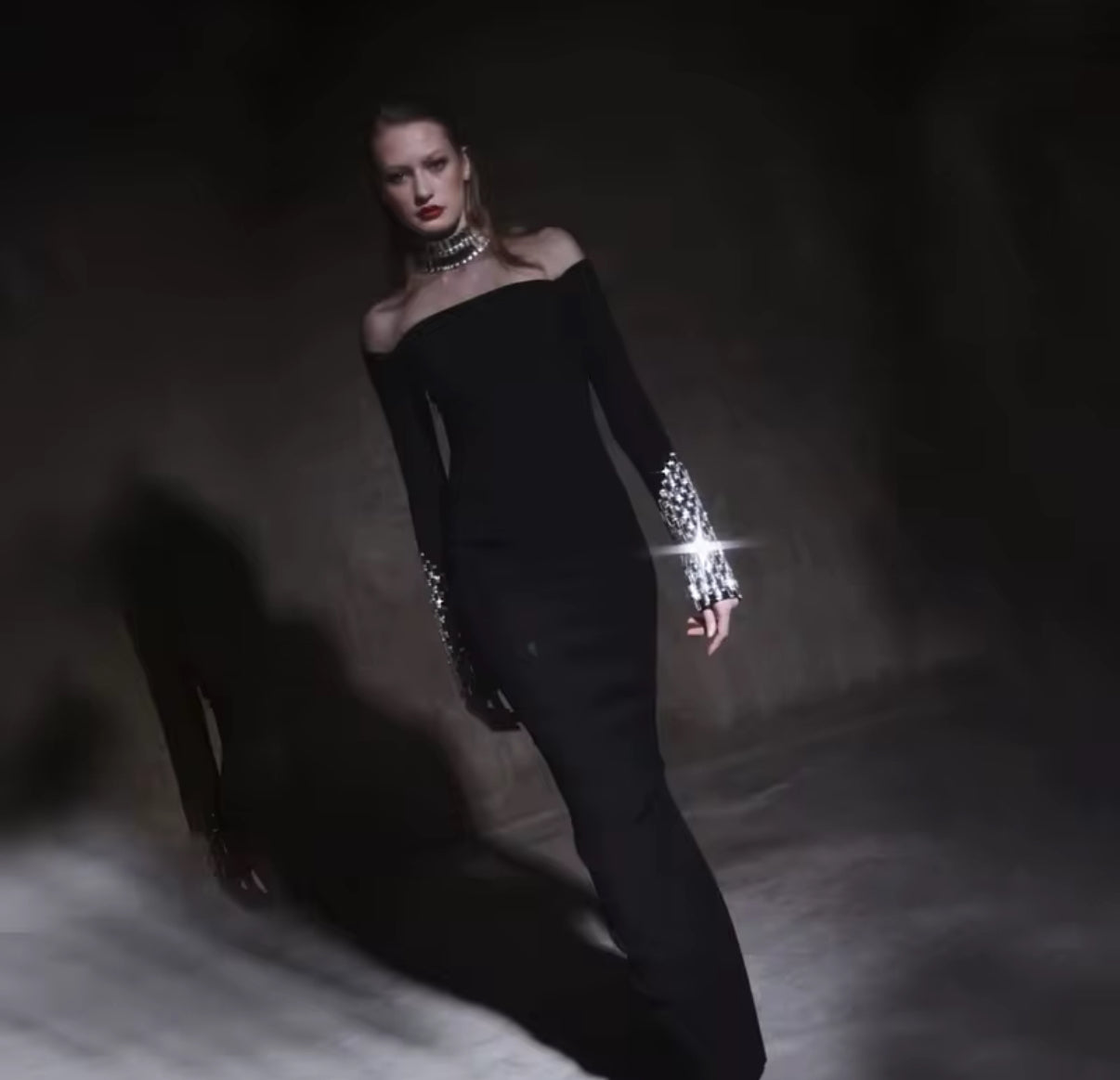 Black off-shoulder dress with crystal-embellished sleeves