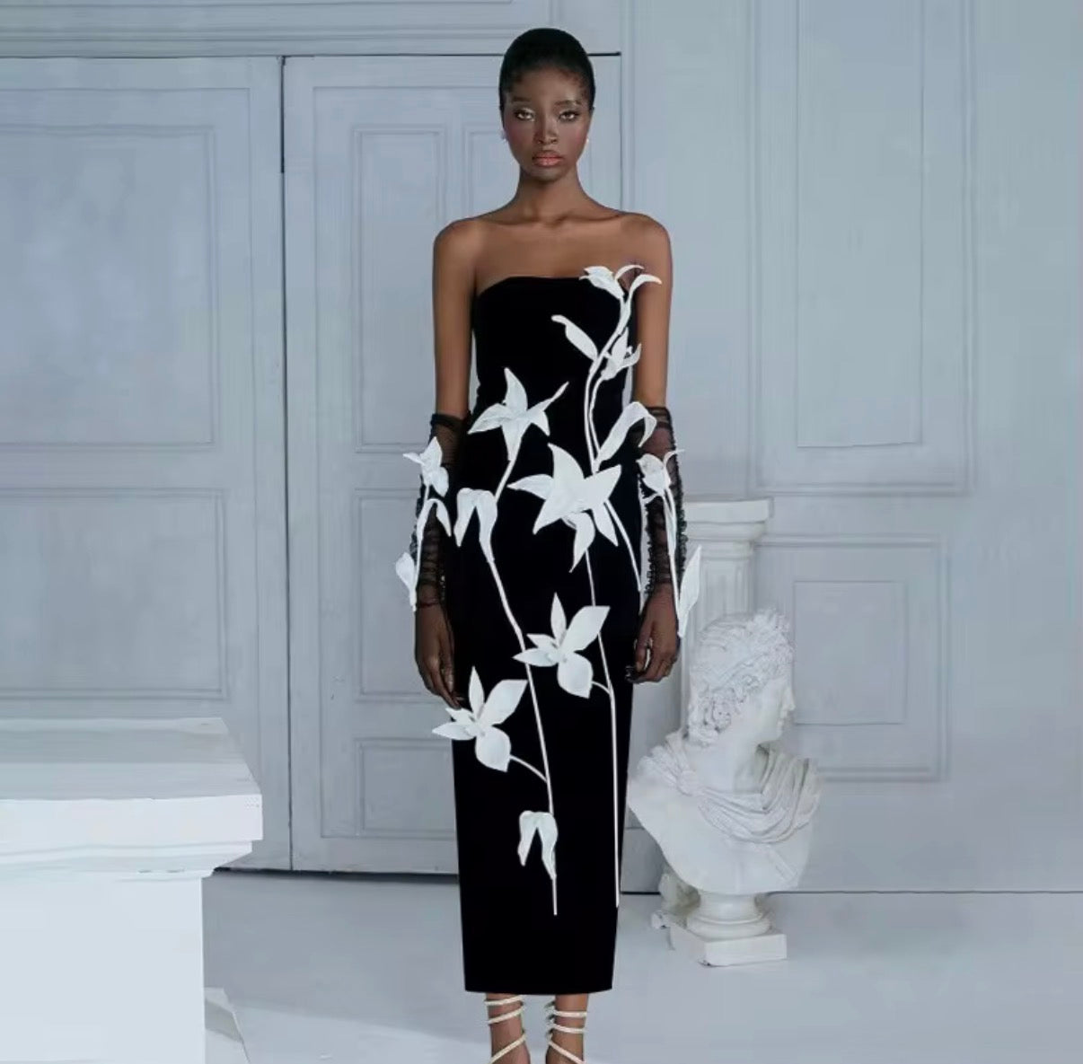 Elegant Strapless Black Column Dress with Sculpted White Floral Appliqué