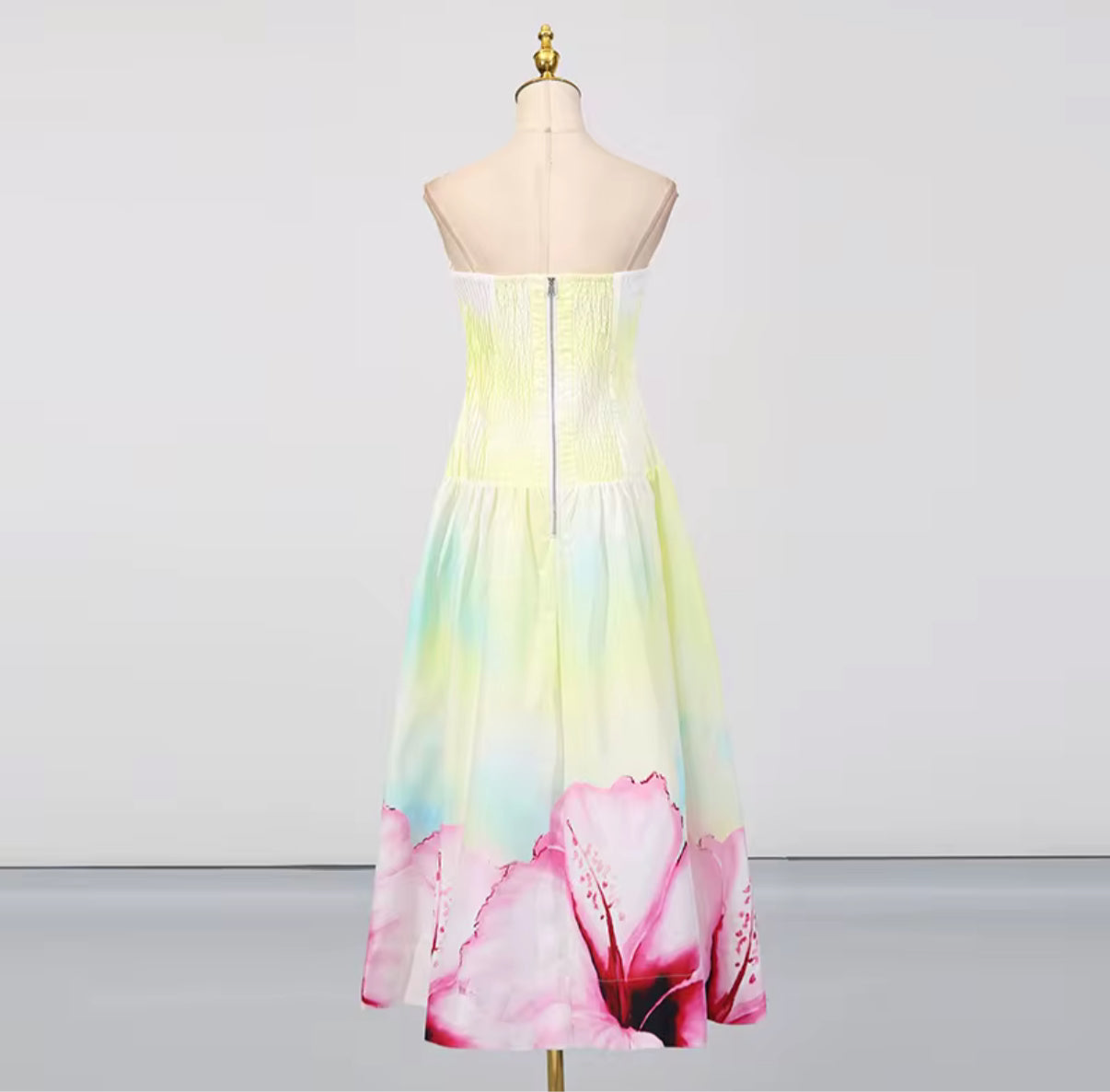 Yellow strapless maxi dress with pink floral hem