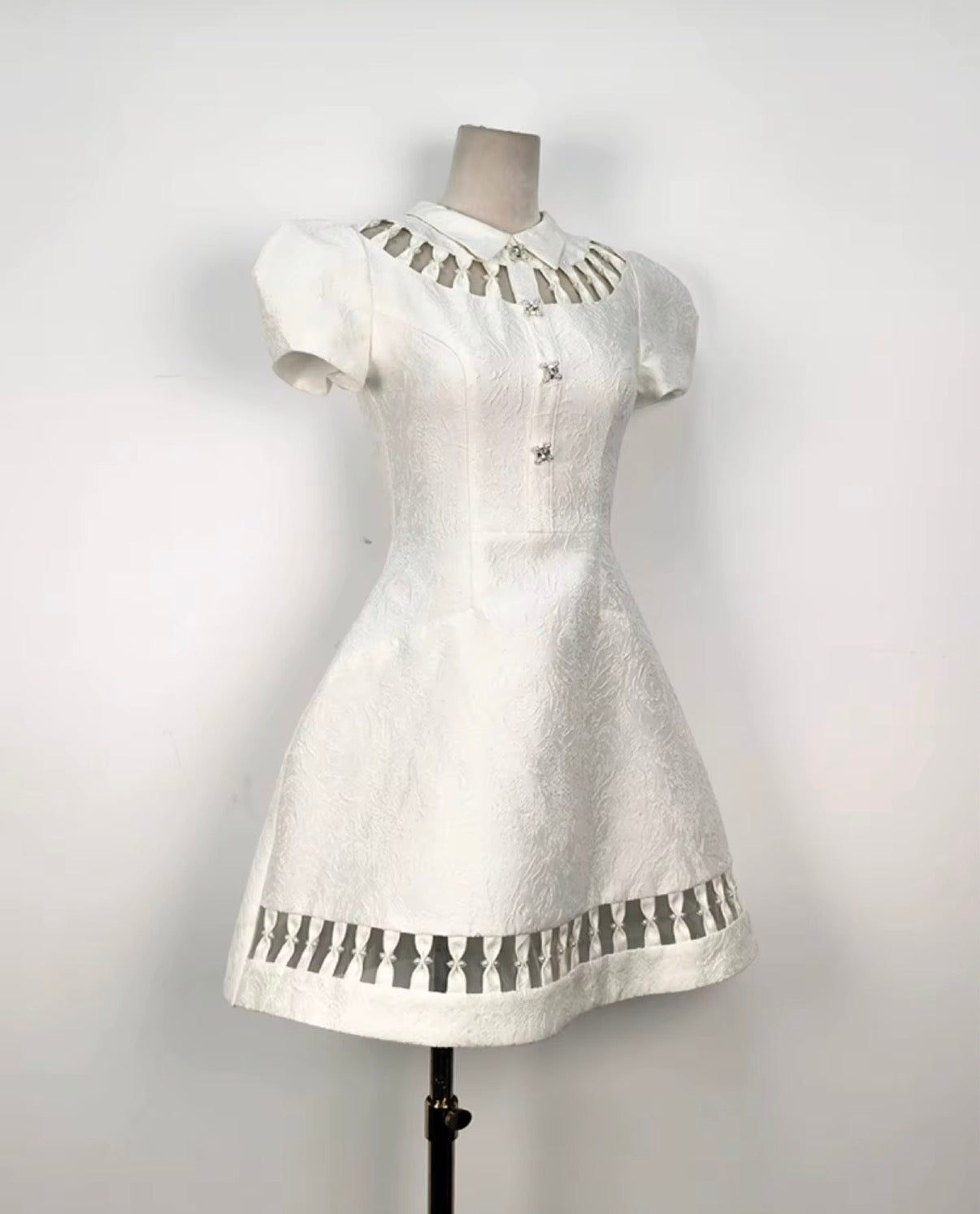 Elegant Textured Mini Dress with Cutout Collar and Sculpted Puff Sleeves