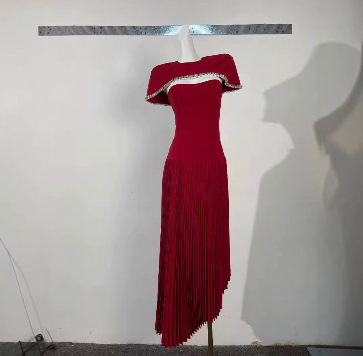 Asymmetric Pleated Maxi Dress with Embellished Cape Neckline