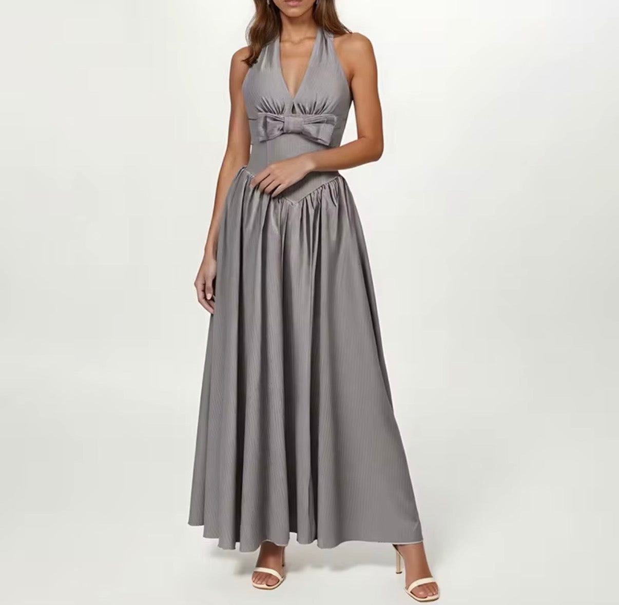 Elegant Halter Neck Maxi Dress with Sculpted Waist and Statement Bow Detail