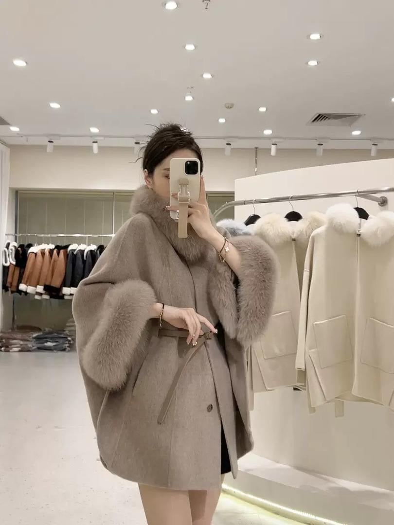 Luxurious wool cape coat with belted waist and plush fur trim