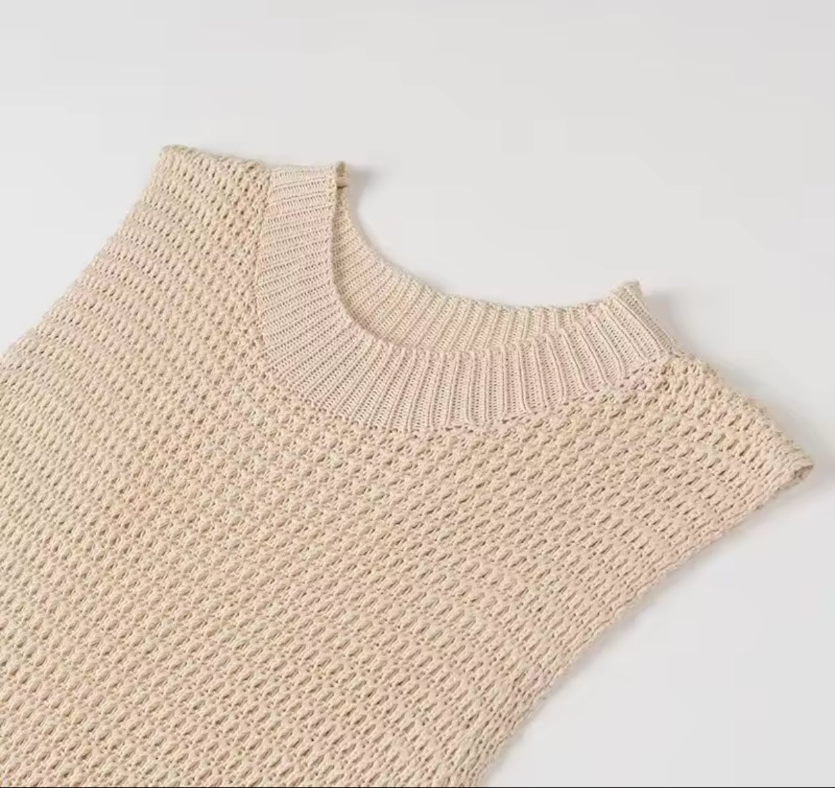 Beige knit mini dress with layered fringe hem