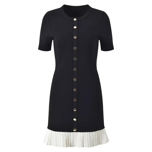 Black fitted dress with statement gold buttons and a playful pleated hem