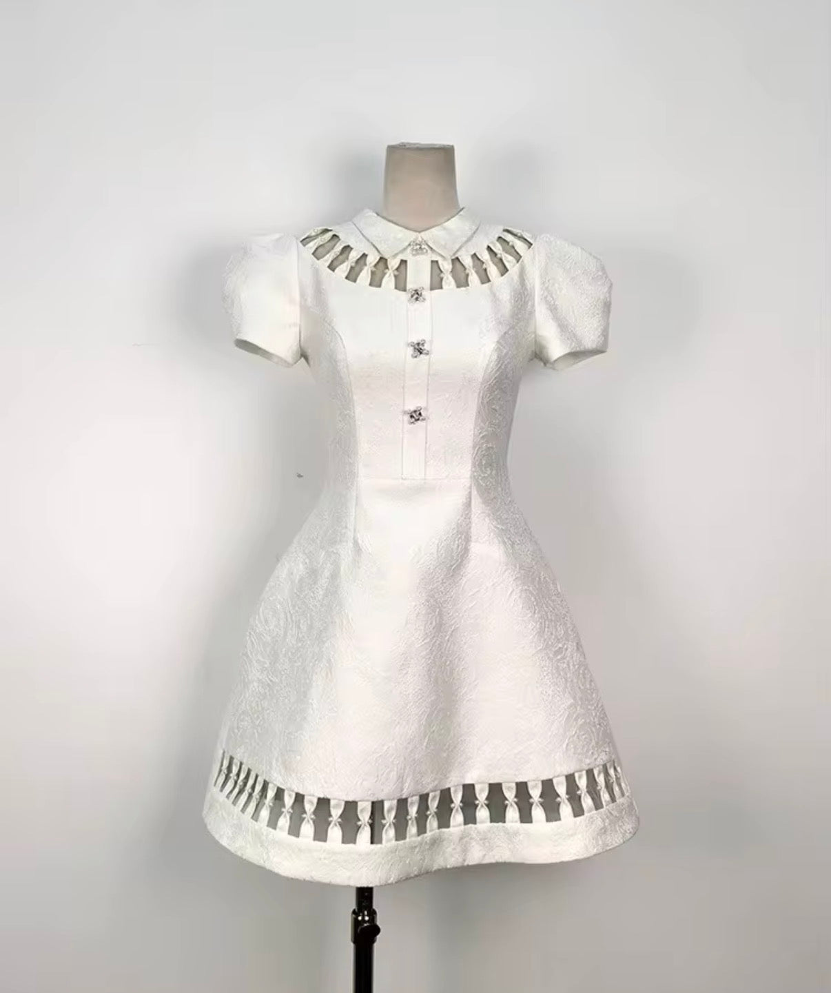 Elegant Textured Mini Dress with Cutout Collar and Sculpted Puff Sleeves