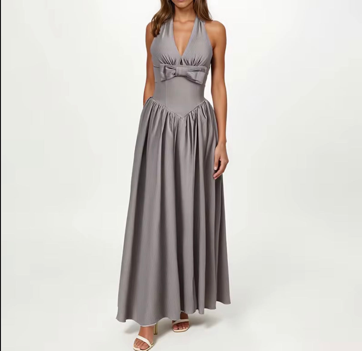Elegant Halter Neck Maxi Dress with Sculpted Waist and Statement Bow Detail