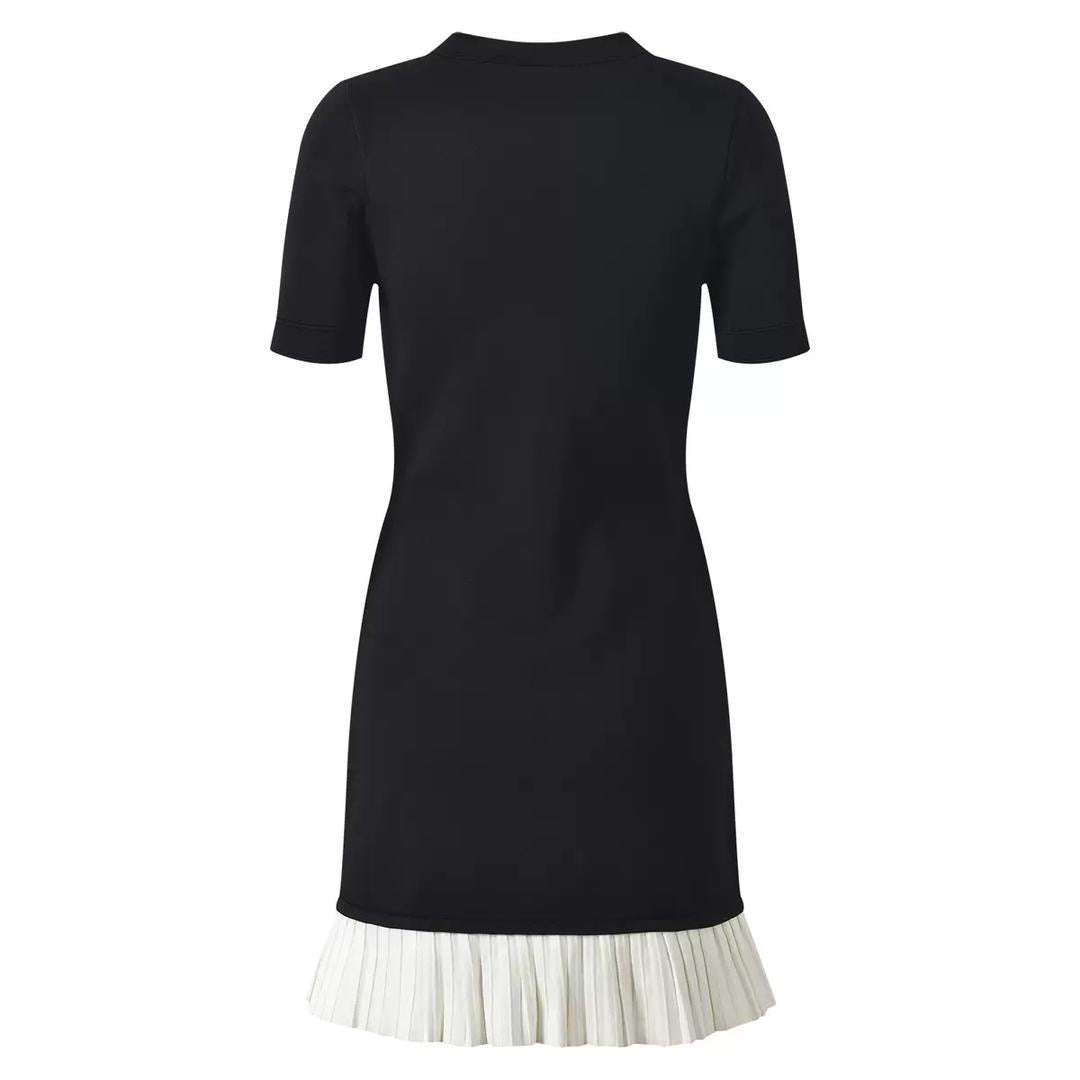 Black fitted dress with statement gold buttons and a playful pleated hem