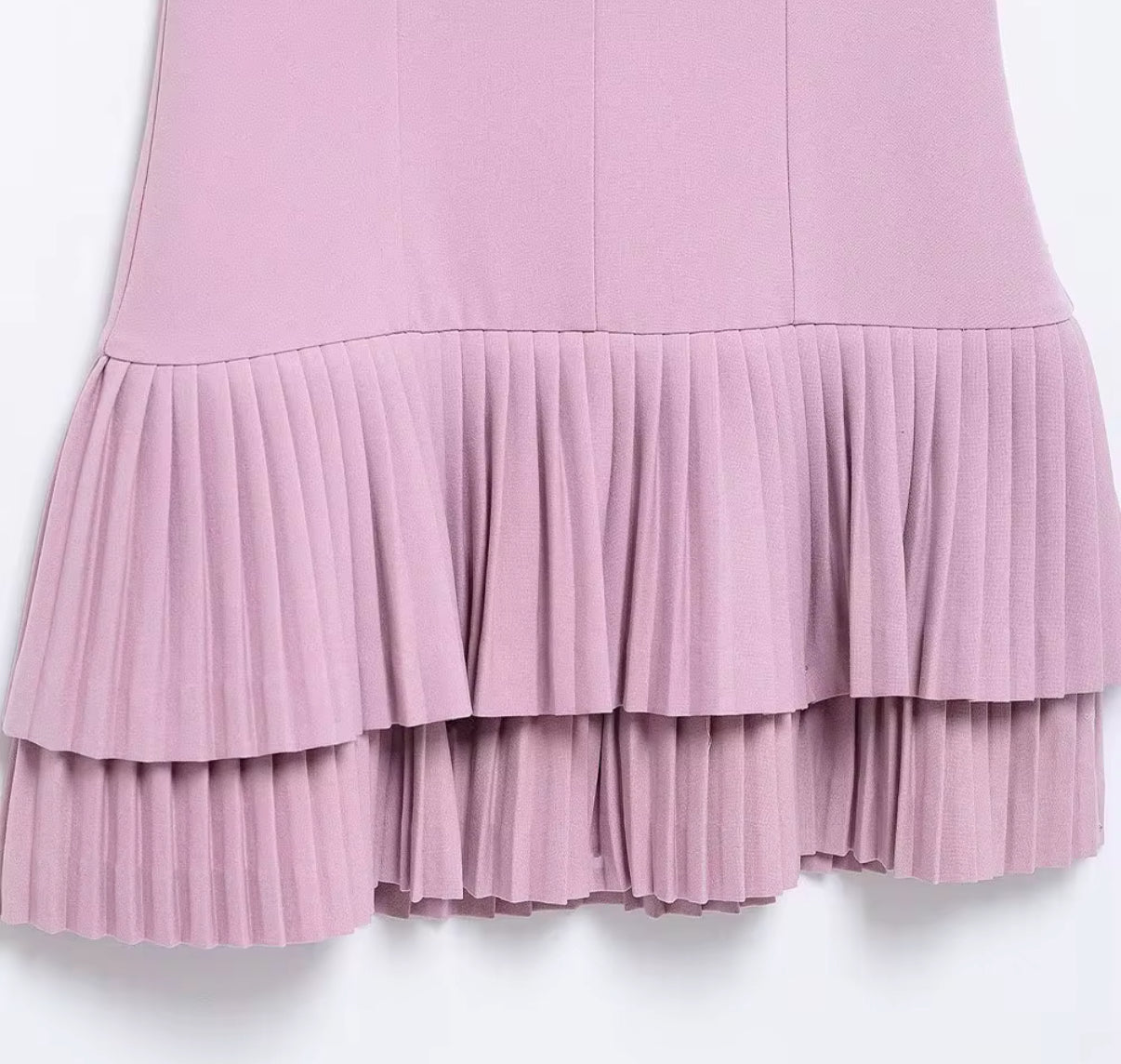 fitted bodice with a playful pleated layered hem dress