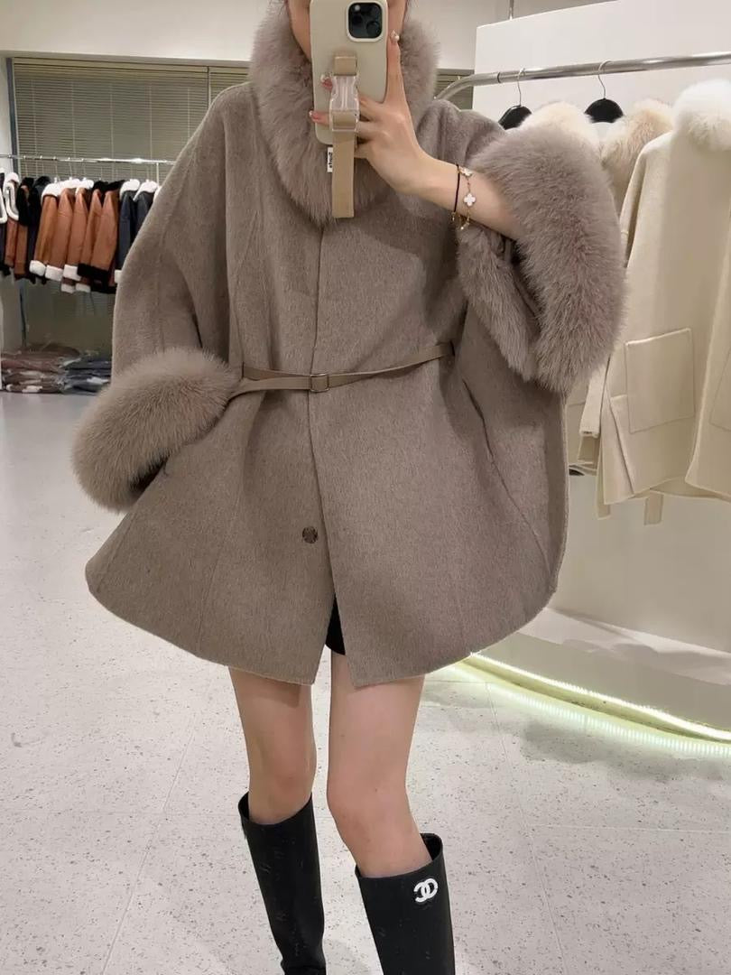 Luxurious wool cape coat with belted waist and plush fur trim